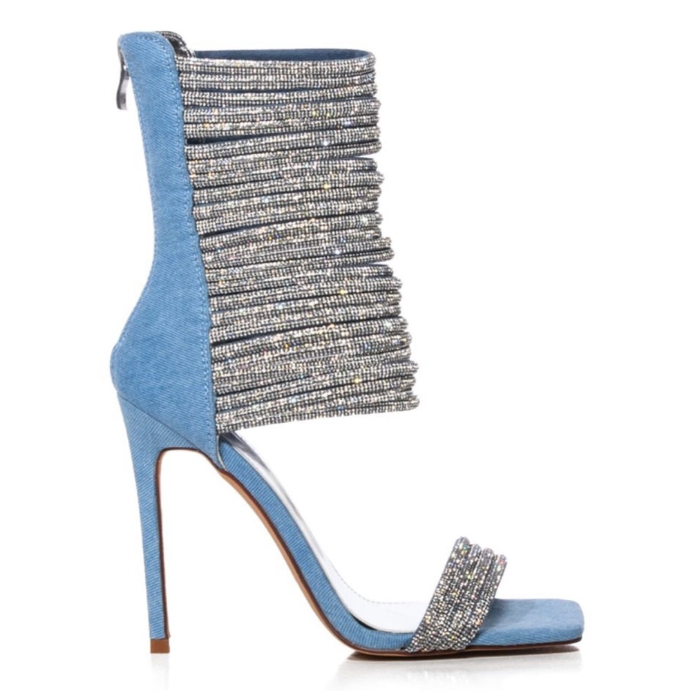 Light denim, open square toe, strappy rhinestone band detailing & stiletto heel.